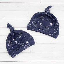 Load image into Gallery viewer, A pair of knot hats with a buffalo constellation and star design 1