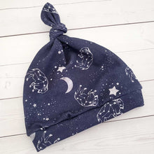 Load image into Gallery viewer, A pair of knot hats with a buffalo constellation and star design 3